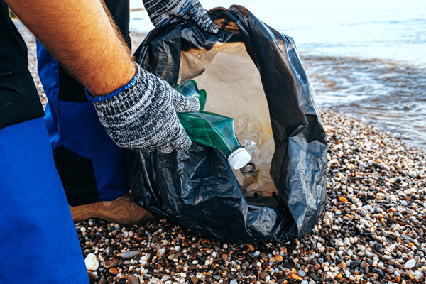 hand-of-a-man-volunteer-grabbing-plastic-litter-in-2021-09-03-02-33-46-utc.jpg